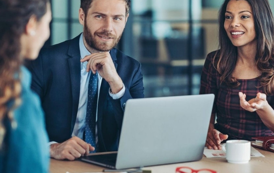 Three people in a meeting