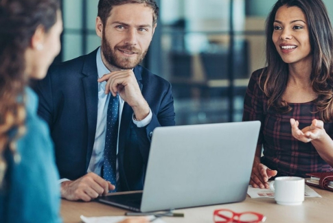 Three people in a meeting